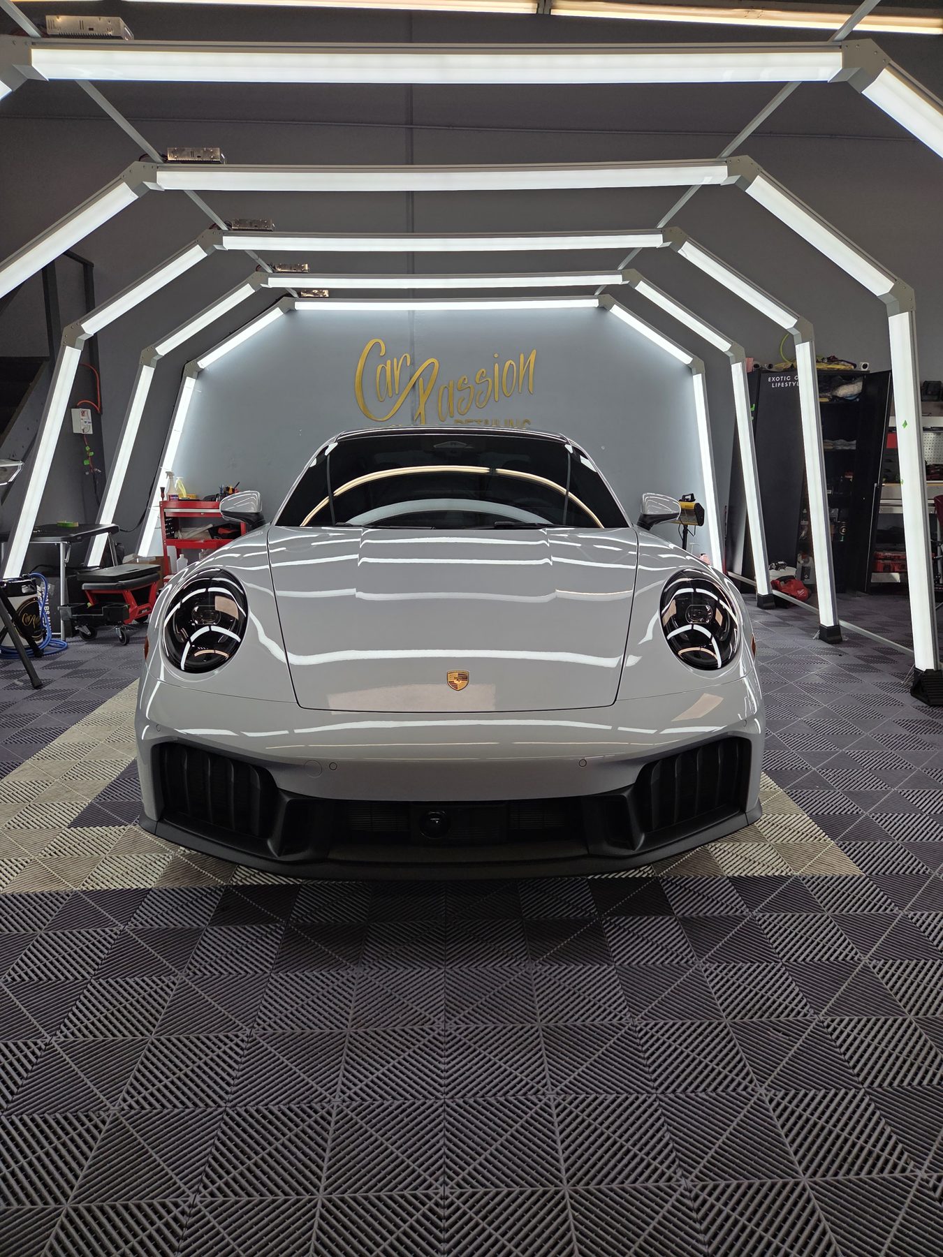 Silver Porsche 911 Carrera GTS at the Car Passion Solutions shop in Pomona