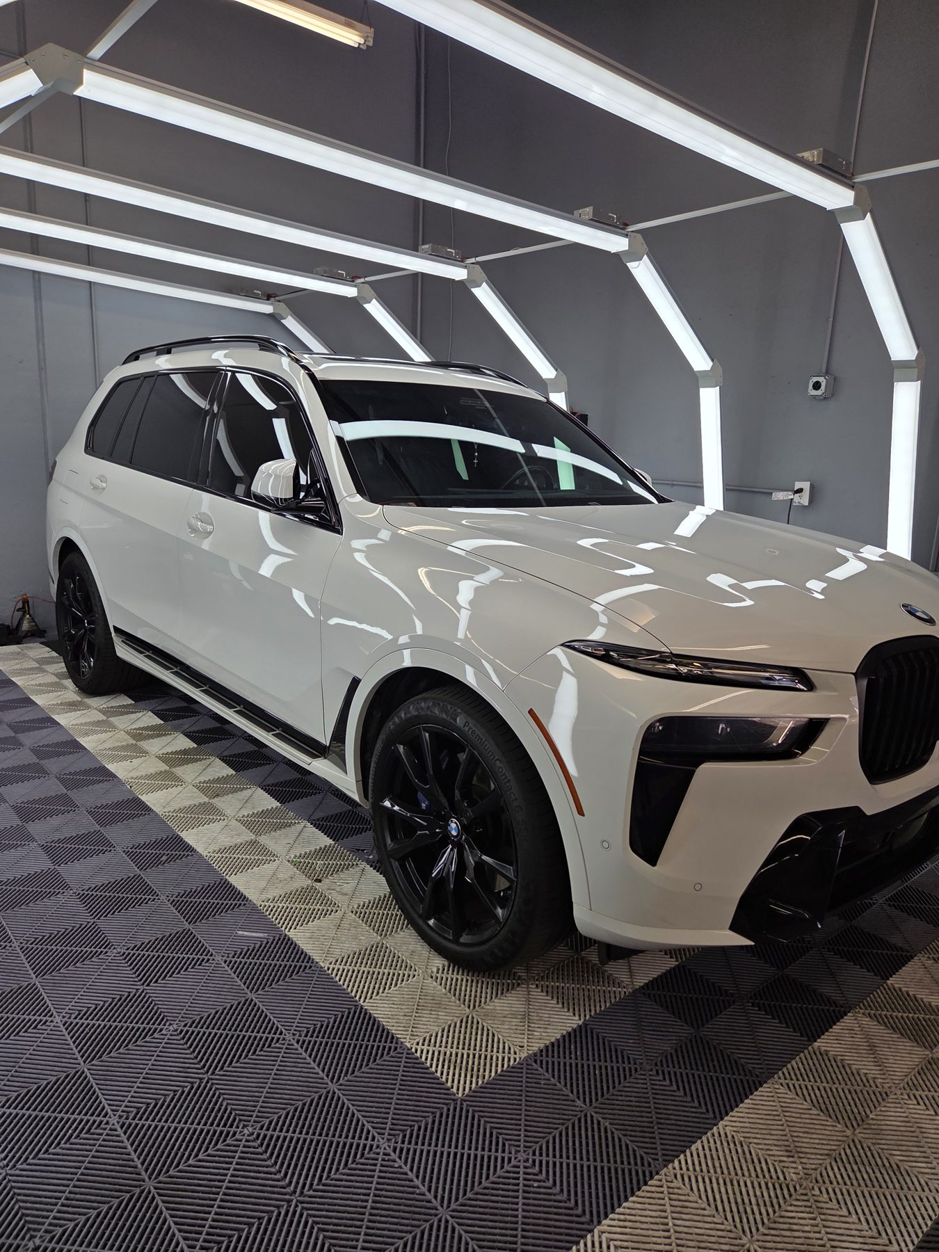 White BMW X7 with professionally installed window tint by Car Passion Solutions